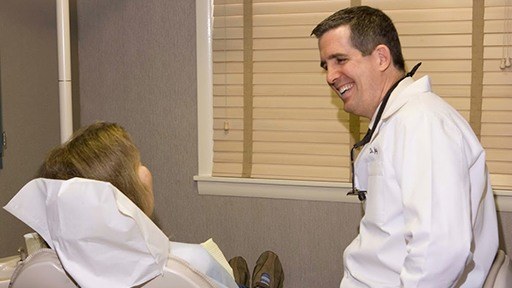Dr. Jay McCarl smiling at dental patient